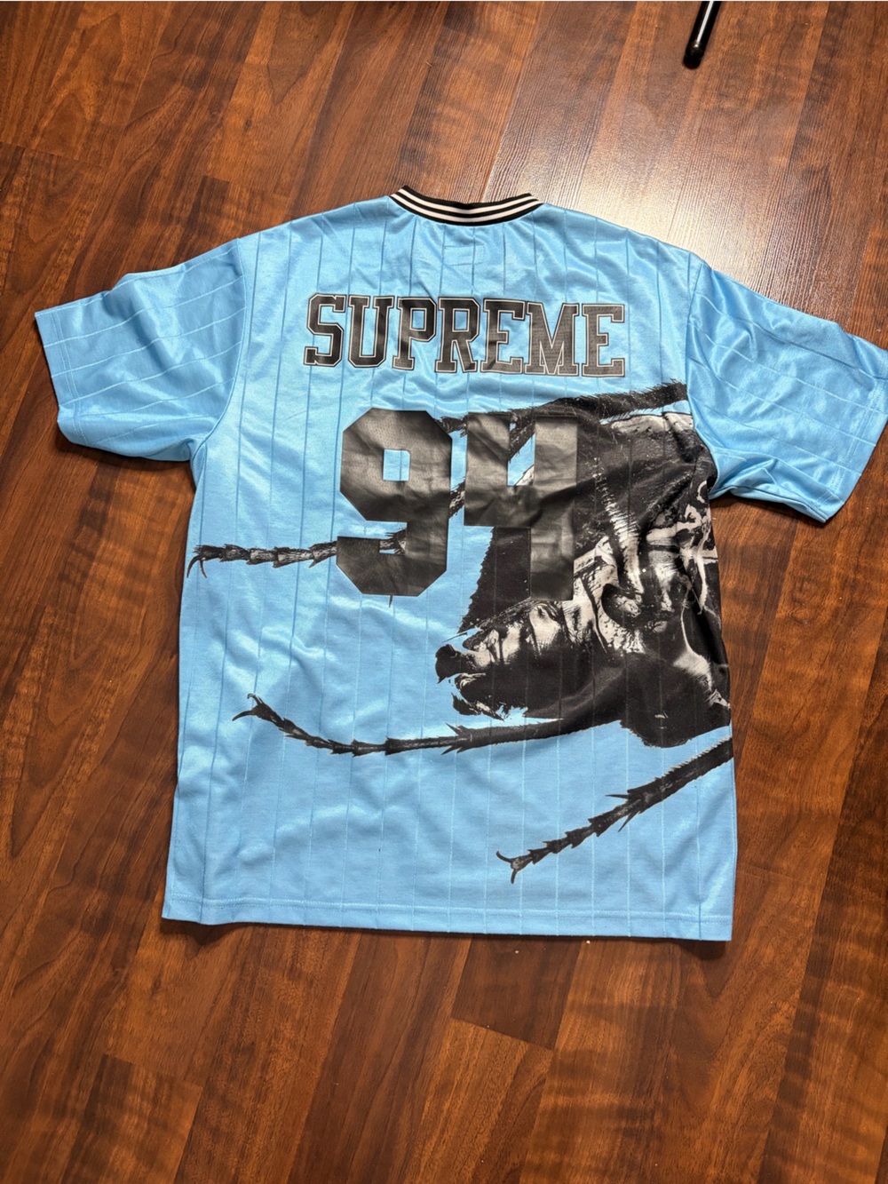 Supreme Light Blue Graphic T-Shirt with Black Print